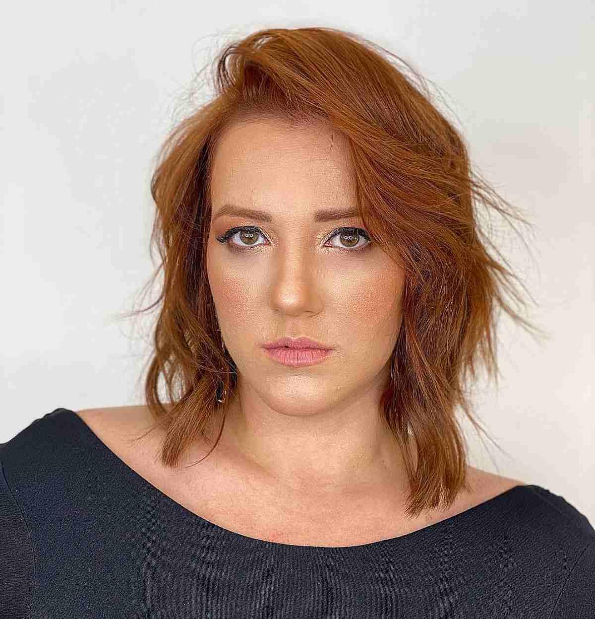 Chic Mid-Length Layered Bob Cut with a Bold Side Part