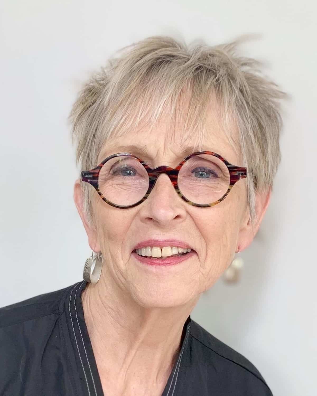 Chic pixie hairstyle for women over 60 with glasses