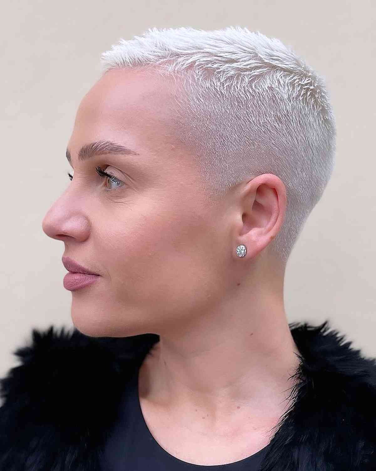 Close-up of a chic platinum blonde buzz cut gender neutral hair