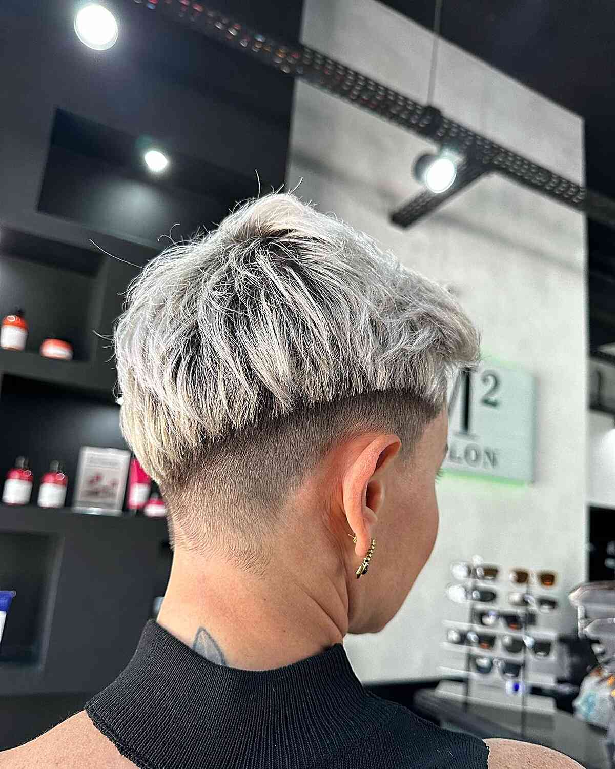 Chic Platinum Pixie with Disconnected Shaved Sides and Nape on Darker Base