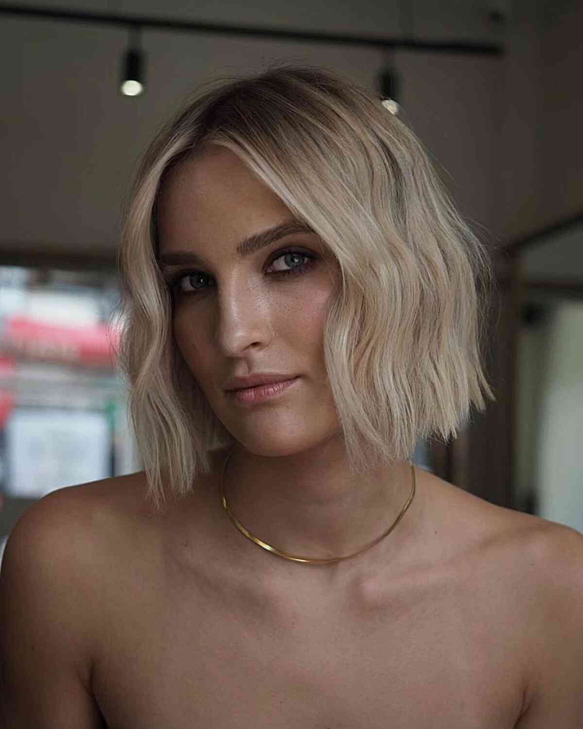 Chic Rooty Blunt Blonde Bob at Chin Length
