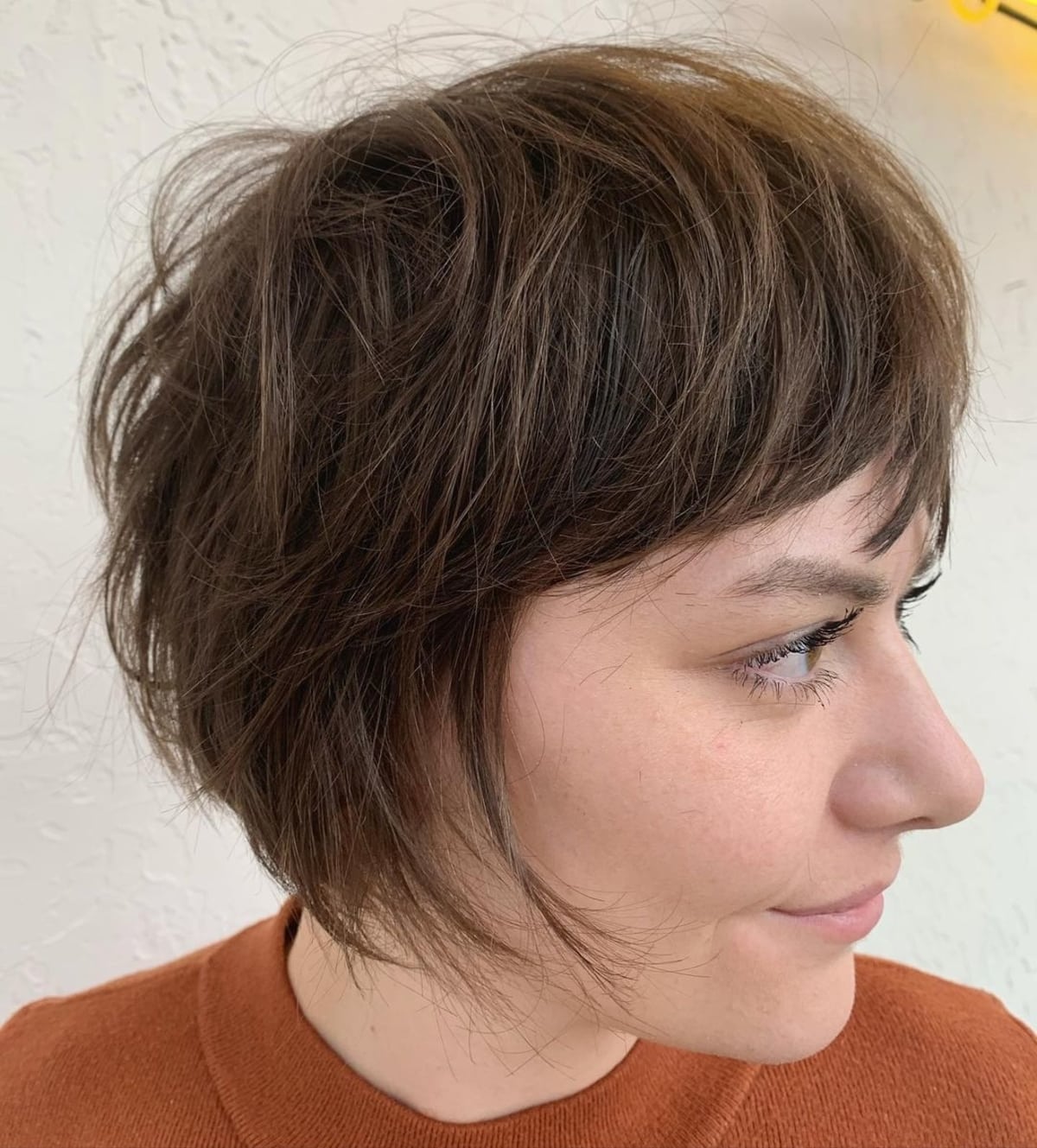 Chic shag haircut on medium brown tresses