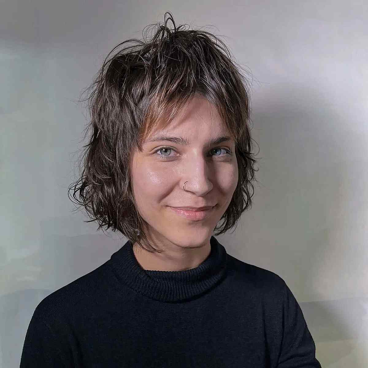 Chic Shagged Bob with Minimal Layers and Curtain Bangs