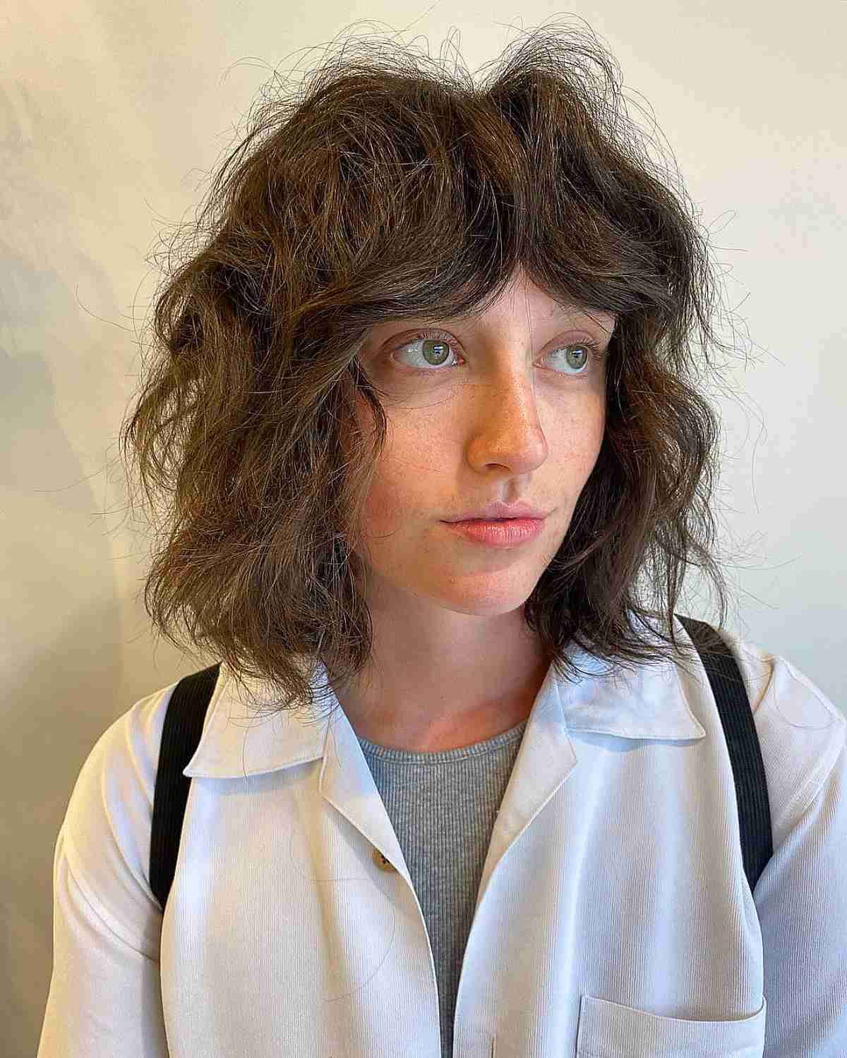Curtain Bangs and Chic Shaggy Layers on Thick Hair