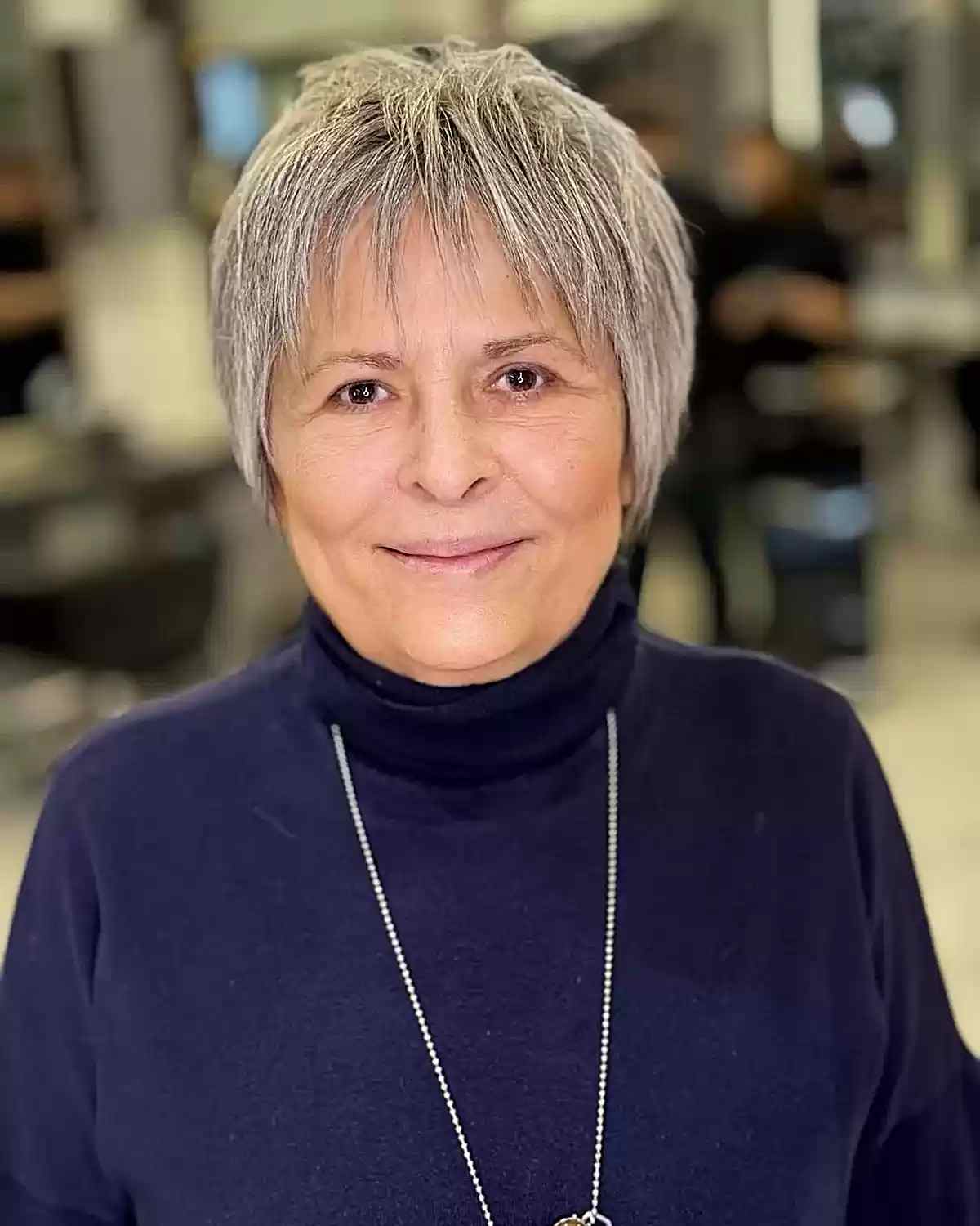 Chic Shaggy Pixie Bob with Subtle Grey Highlights for 50-year-olds