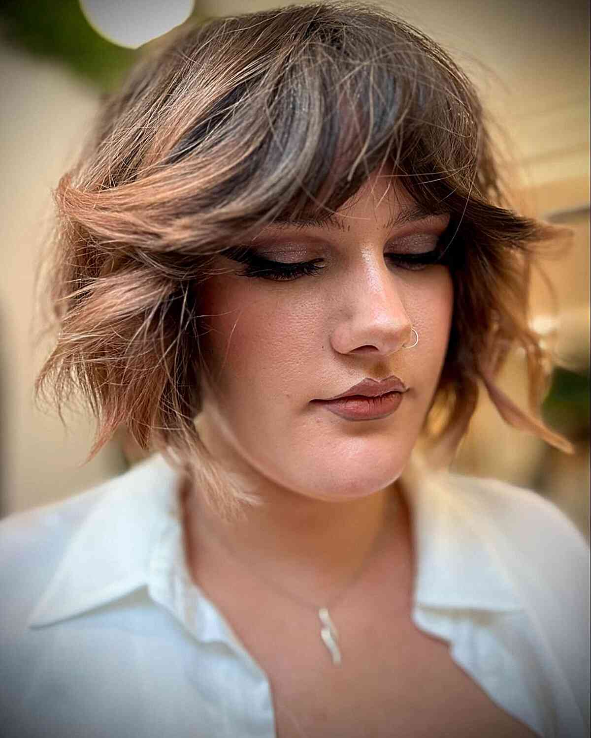 Chin-Length Short Wavy Hair with Layered Swoops and Bangs
