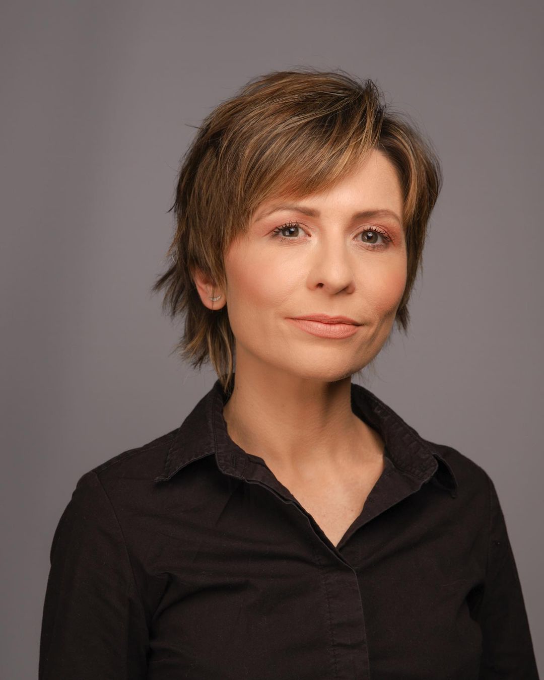 Chic Short Shag Featuring a Side Part and Bangs for Fine Hair