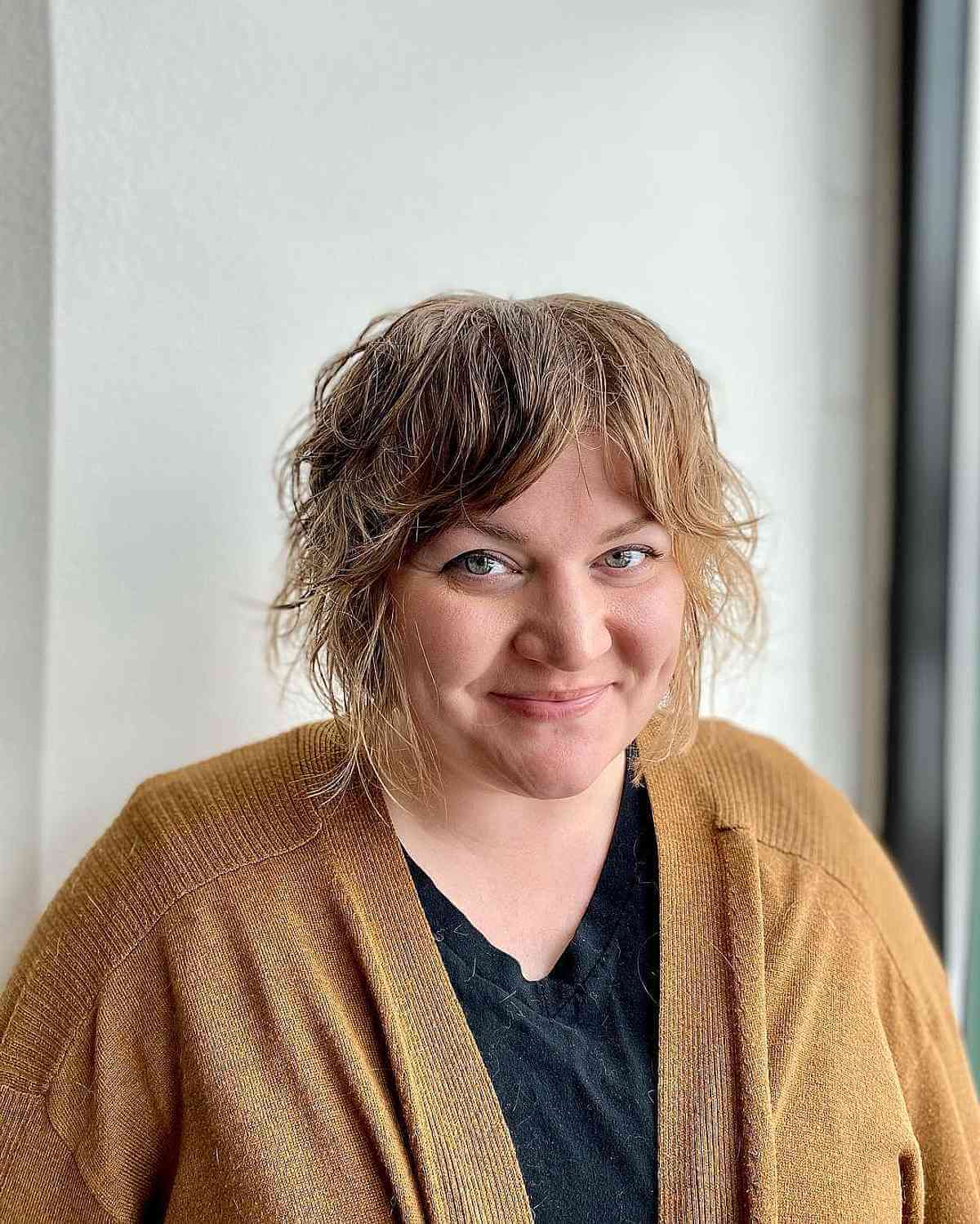 Chic Short Shag with Curtain Bangs for Fine Hair in a Wash-and-Go Style