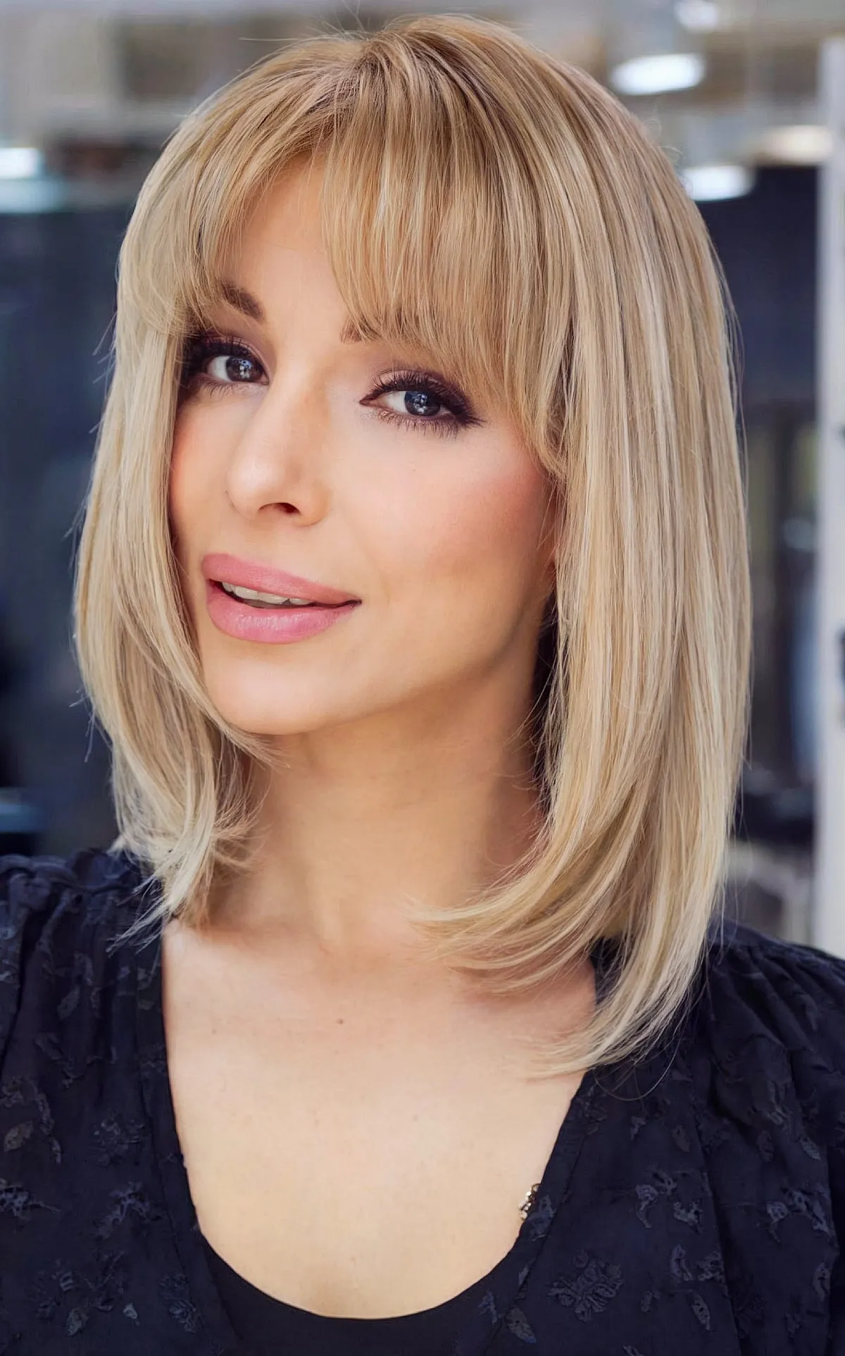 Chic Shoulder-Length Bob with Center-Part Bangs for Thin-Haired Ladies