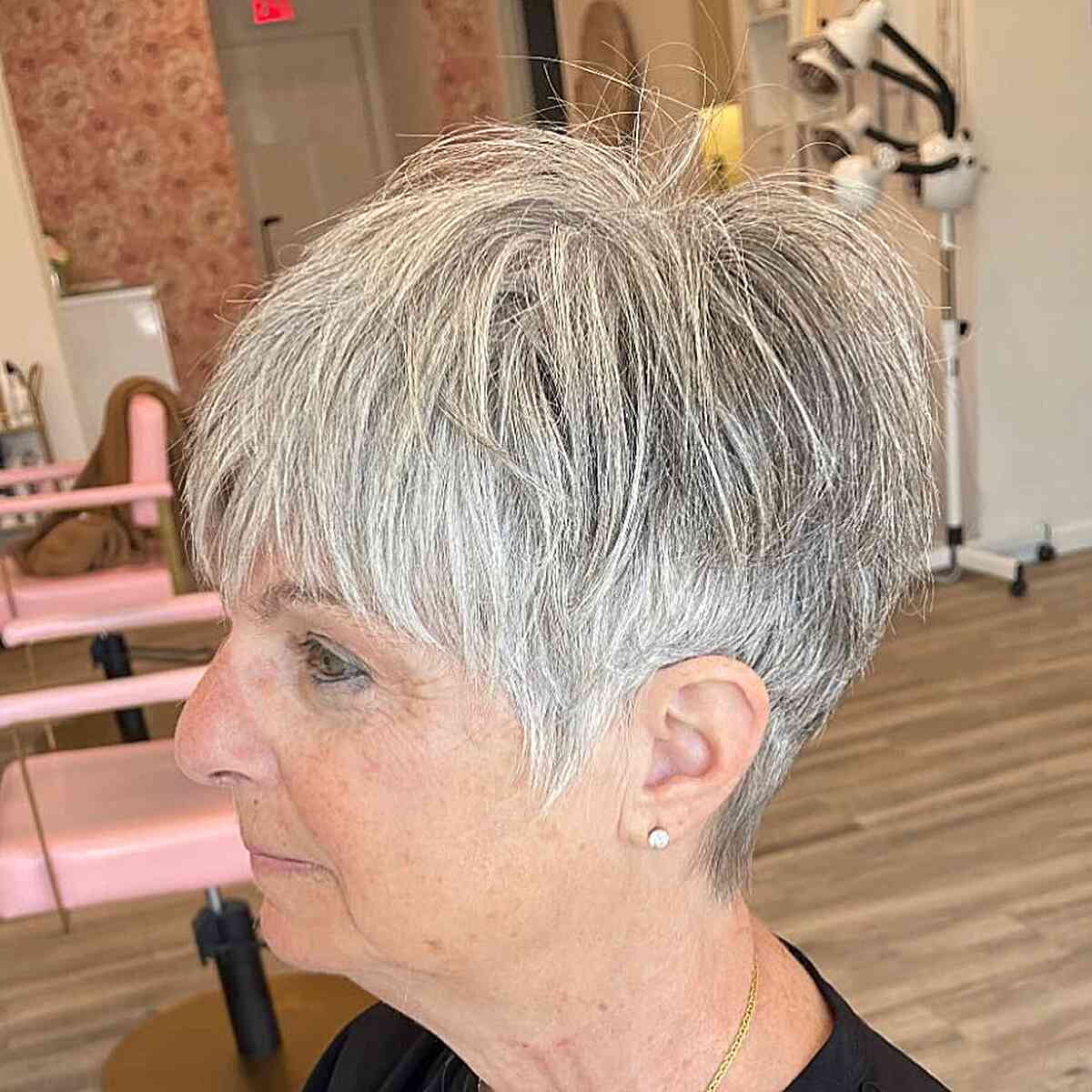 Chic Silver Layered Pixie with Full Bangs for Aging Elegance