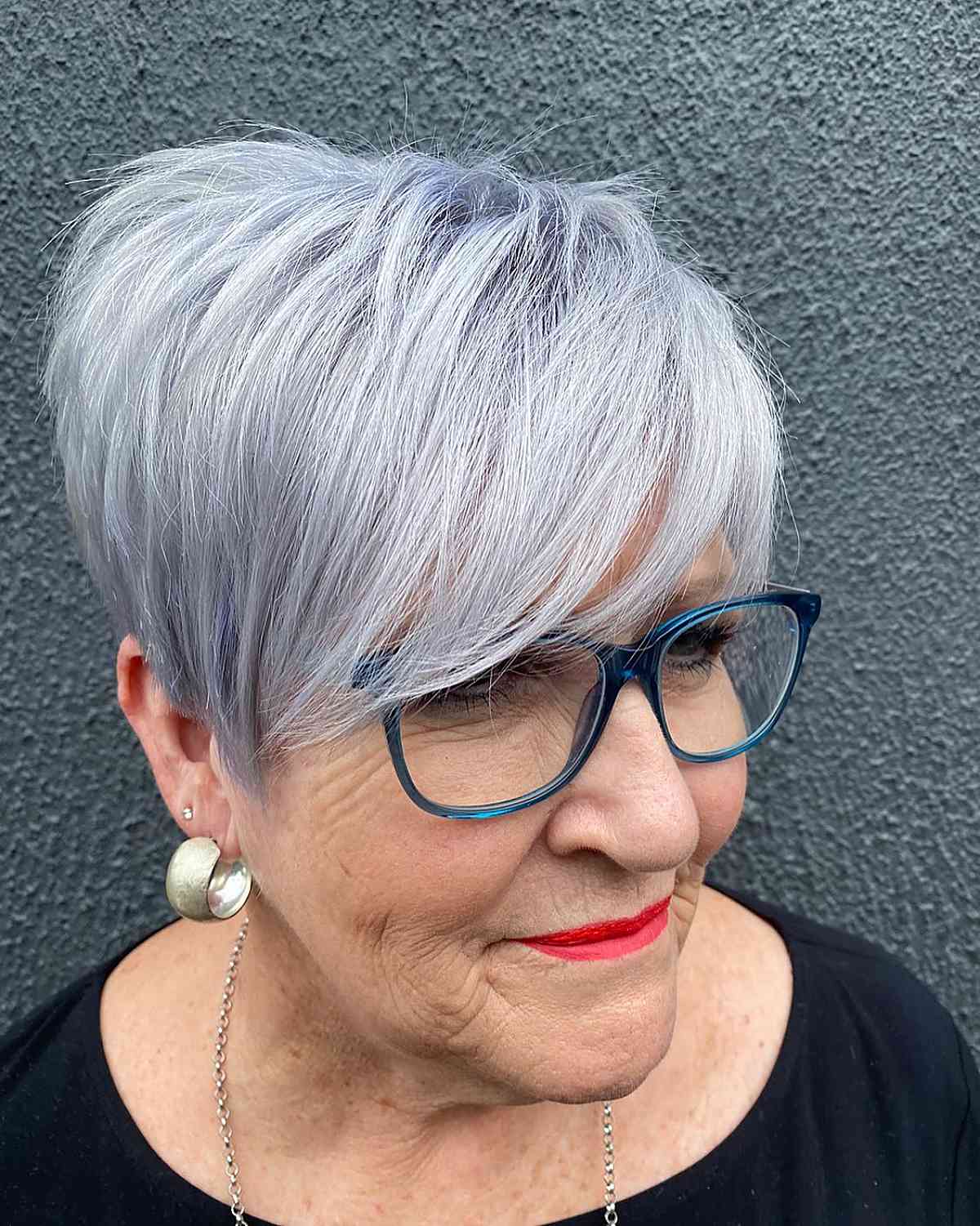 chic silver pixie cut with bangs for senior women who wear glasses