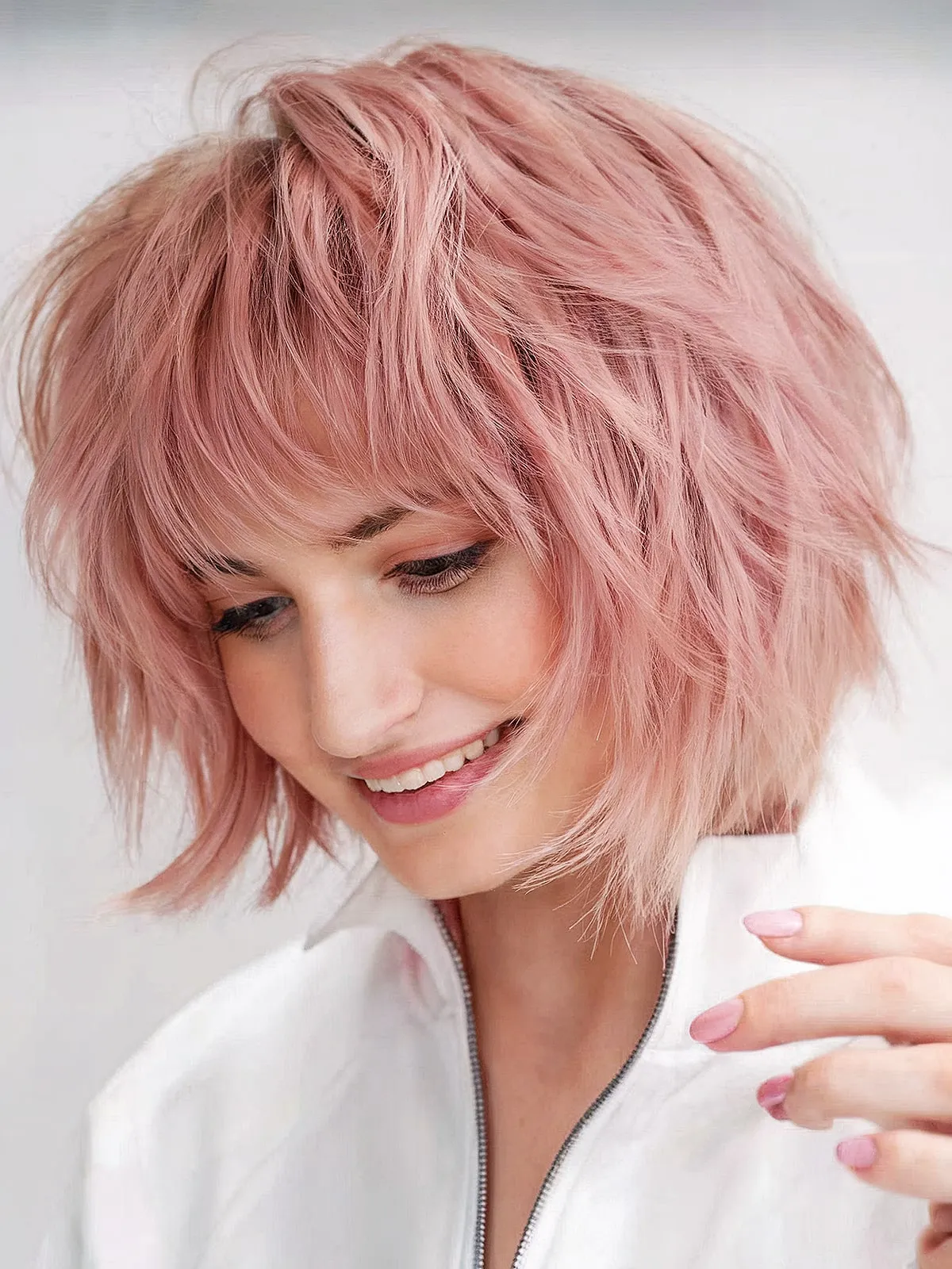 Neck-length Layered Soft Pink Shaggy Bob with Playful Fringe