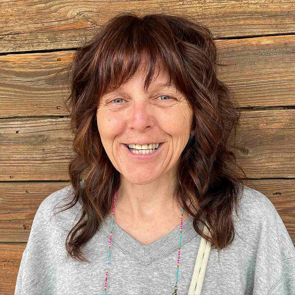 Medium Soft Shag Hairstyle with Fringe for Women Over 70