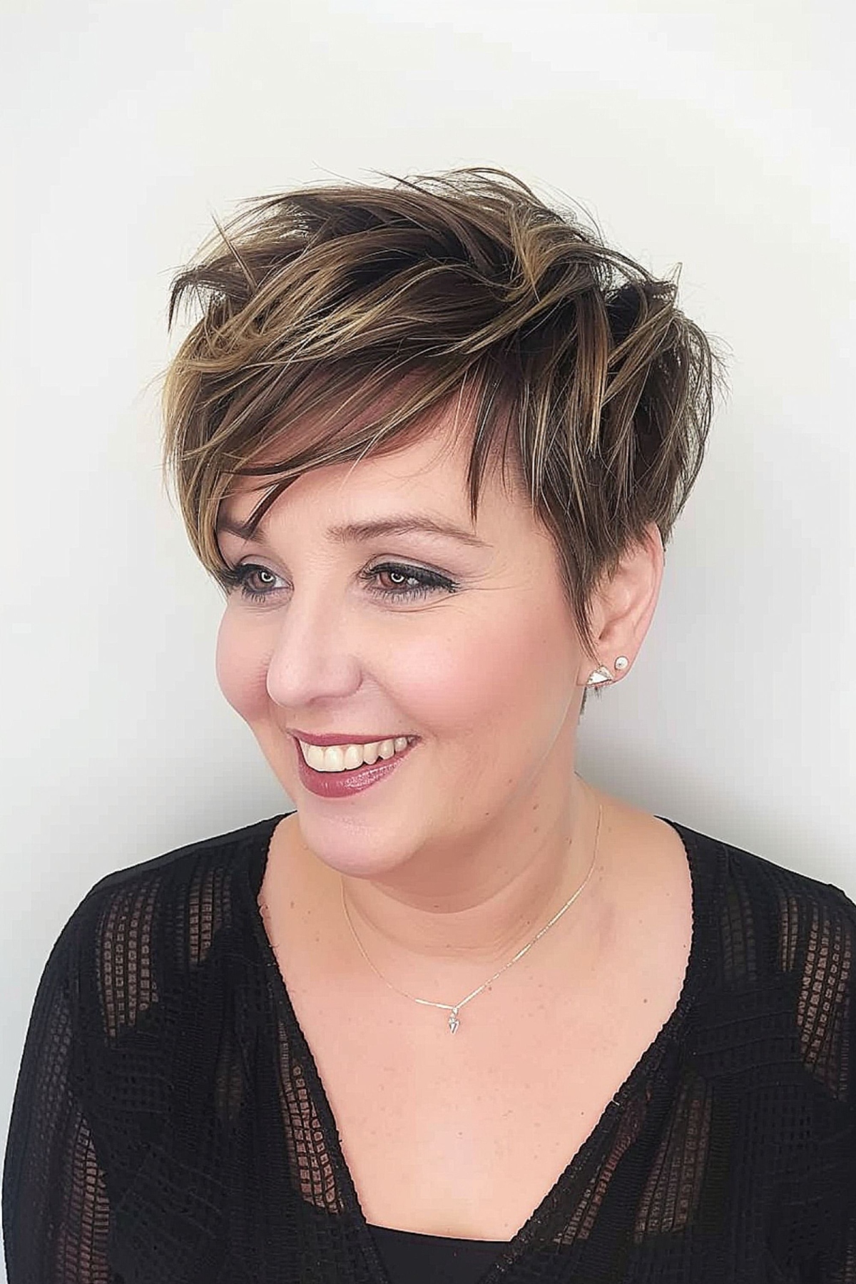 stylish textured pixie with side-swept bangs for round face