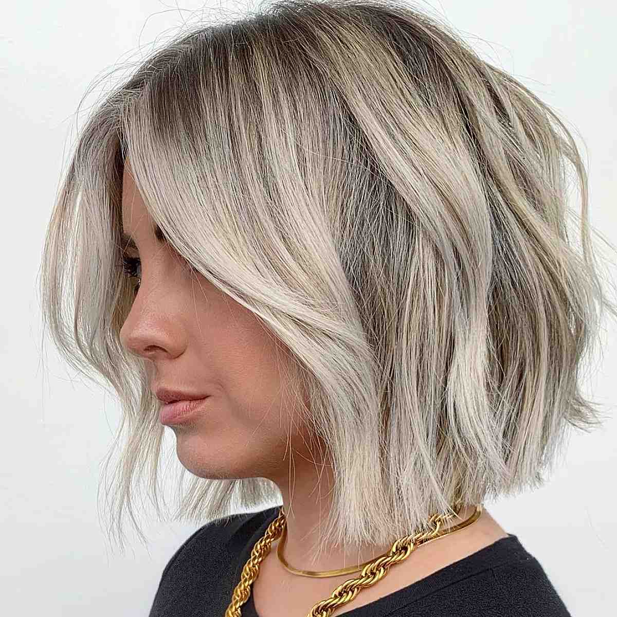 chic textured sandy blonde blunt bob hairstyle