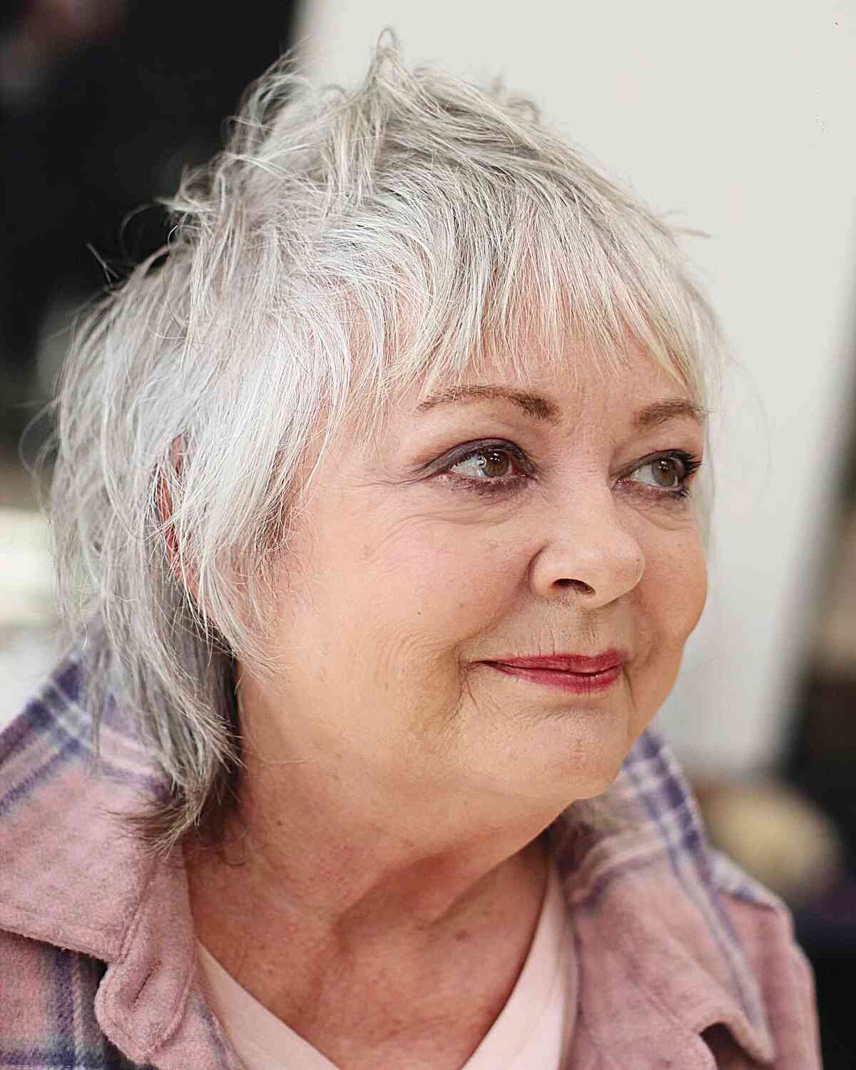 Chic Textured Shaggy Mullet for 60-Year-Old Ladies with Round Faces