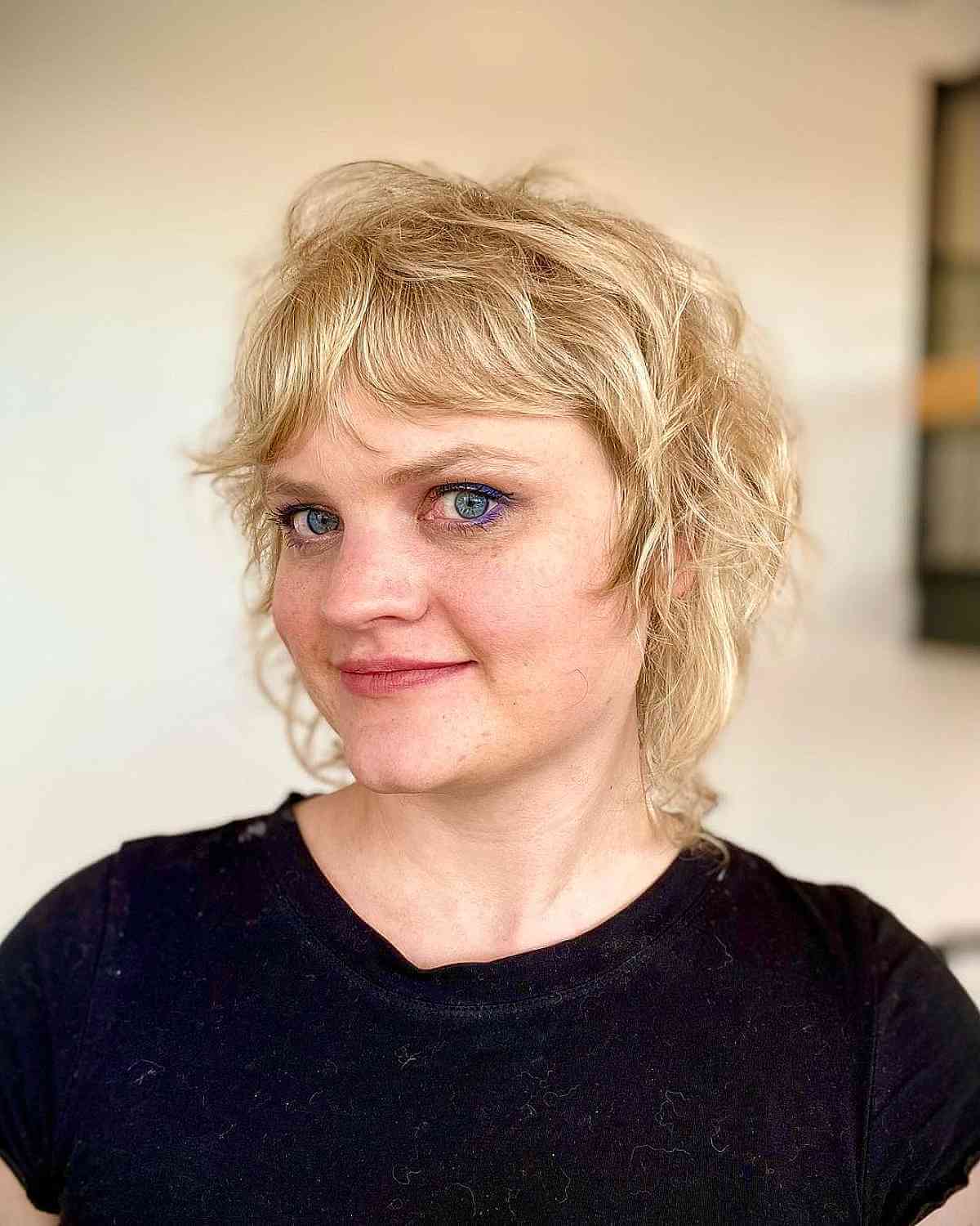 Chic Tousled Shag with Soft Layers and Bangs for Fine Hair