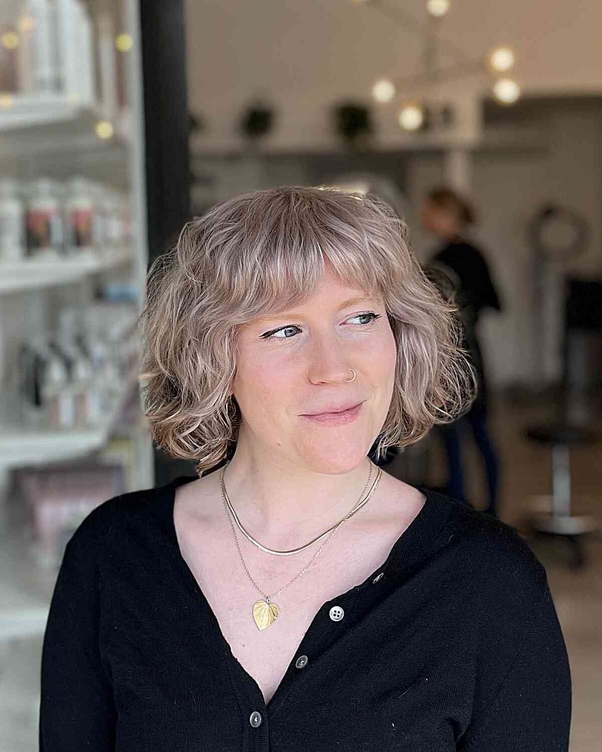 Chilly Blonde Chin-Length Wavy Textured Bob with Gentle Bangs