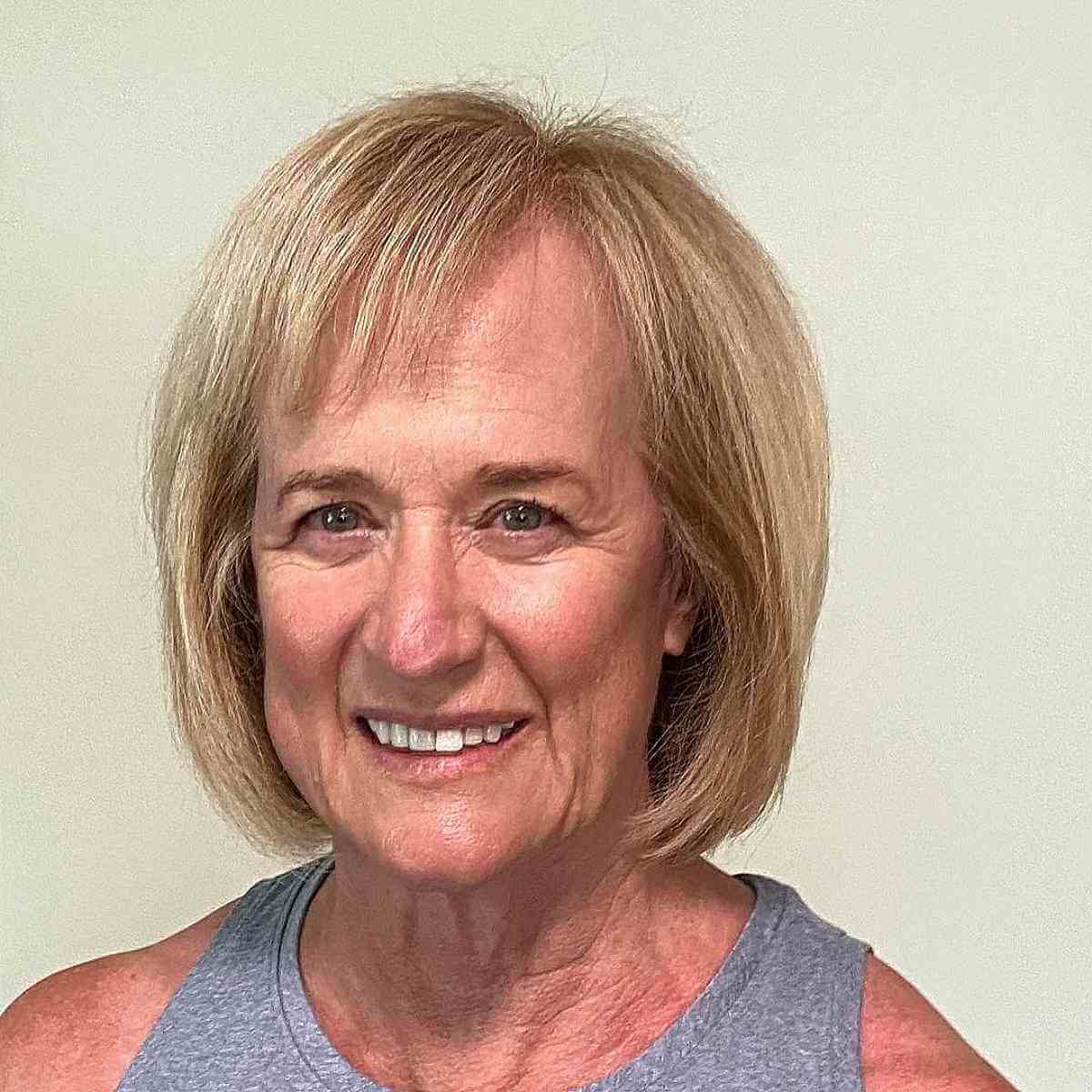 Chin-Length Bob Hairstyle with Short Side Bangs for Women Over Fifty