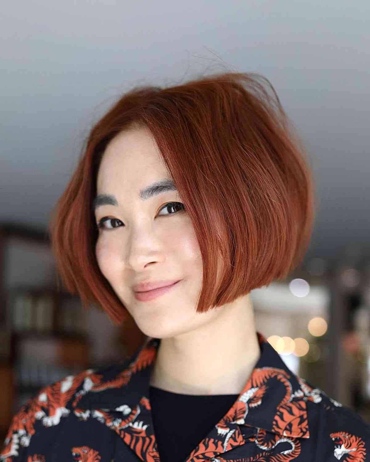Chin-Length Bob with Ginger Red Highlights for Summer