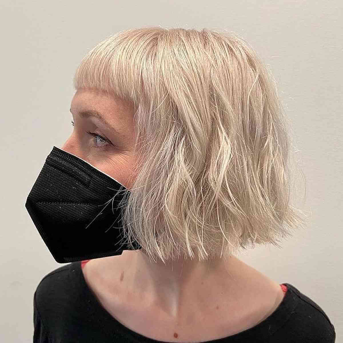 Chin-Length Bob Haircut with Subtle Blunt Bangs