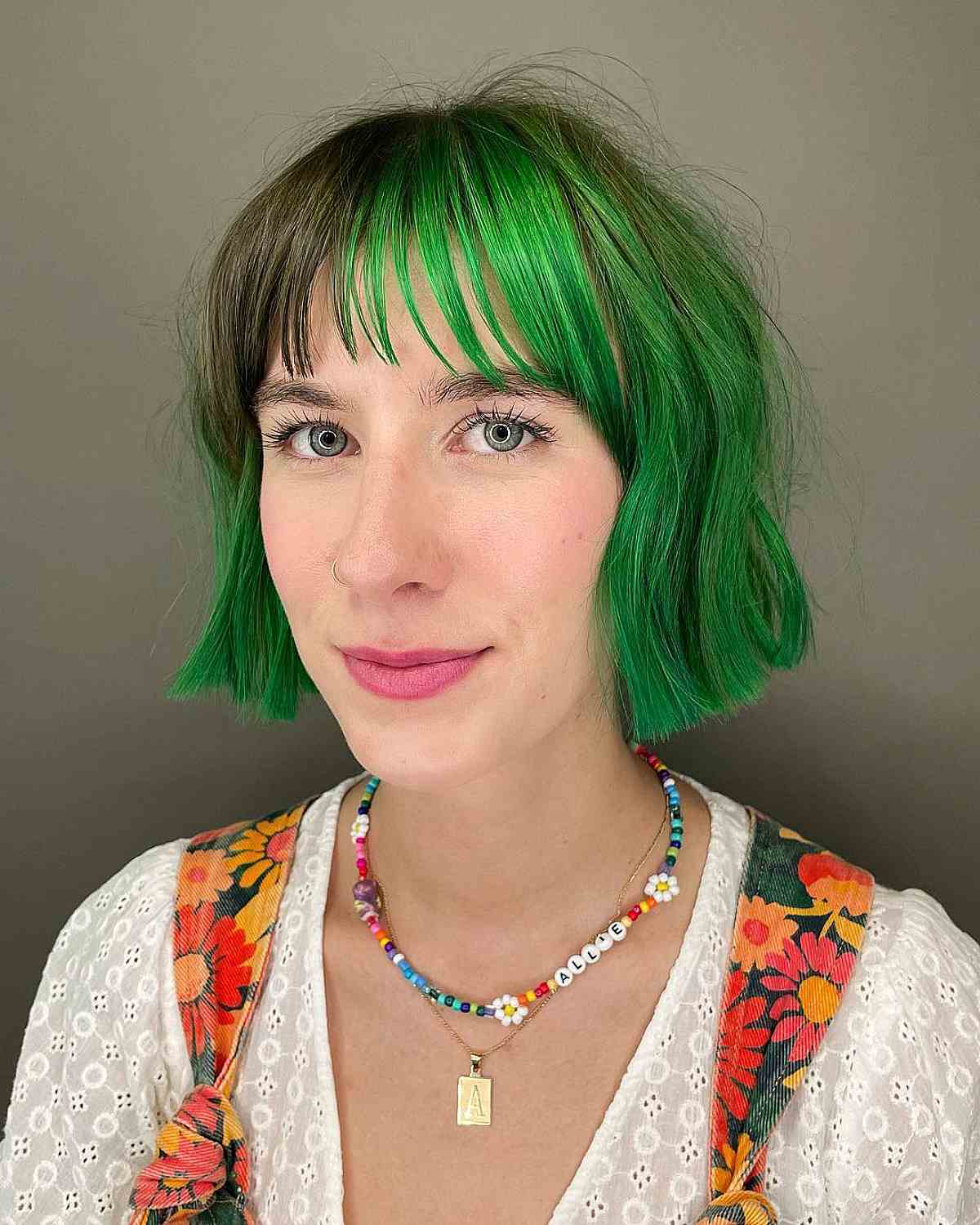 Chin-Length Bob with Textured Bangs on Short Green Chin-Length Hair