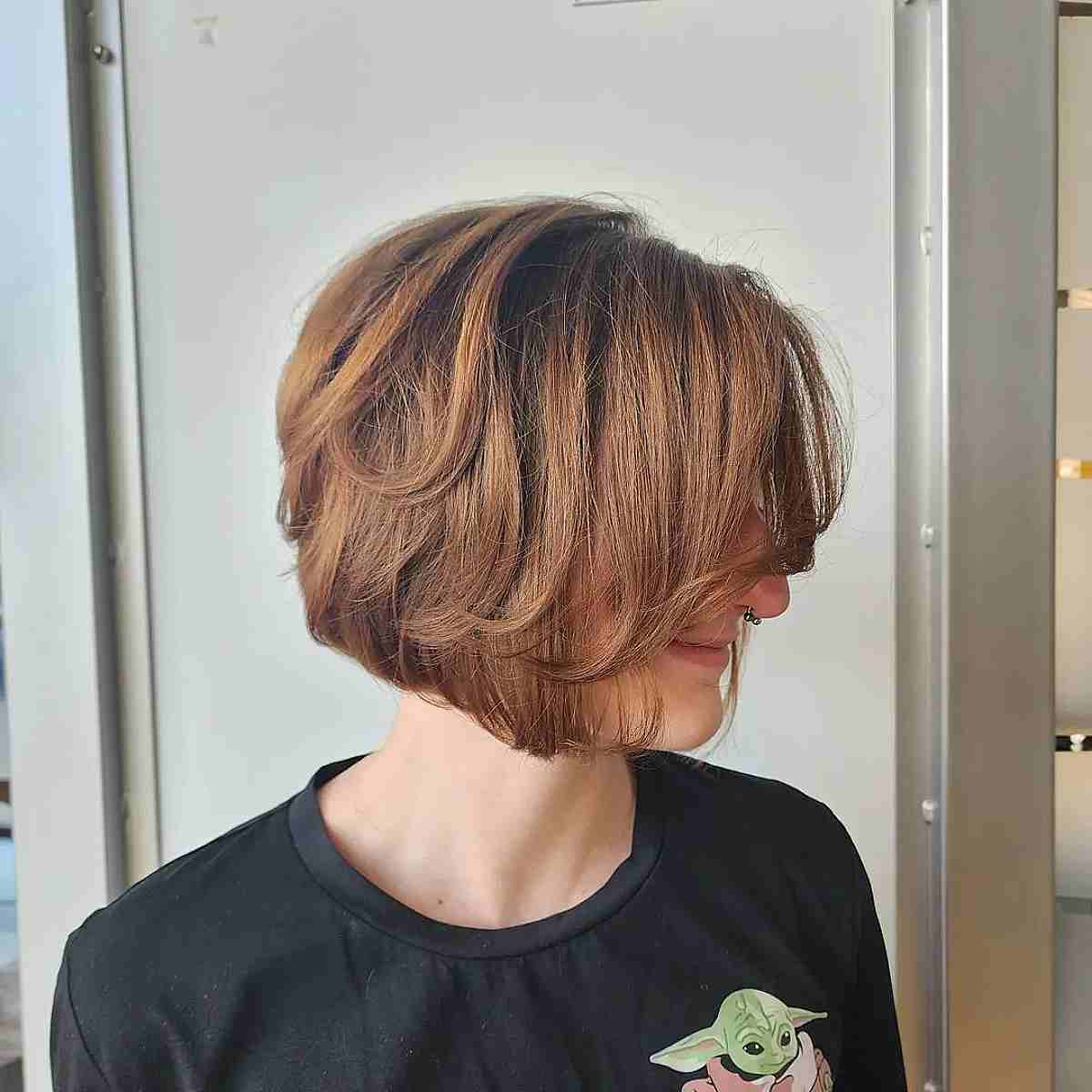 Chin-Length Feathered Choppy Bob Haircut with a Side Fringe
