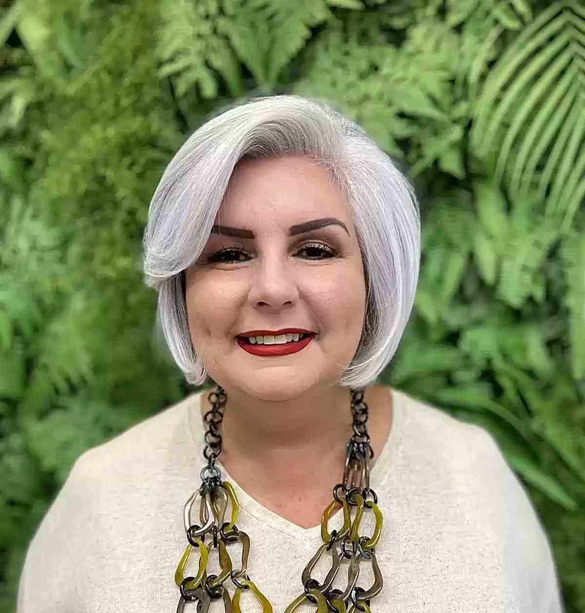 Chin-Length Gray Bob with Side Bangs on Older Women Over 60 with Round Faces