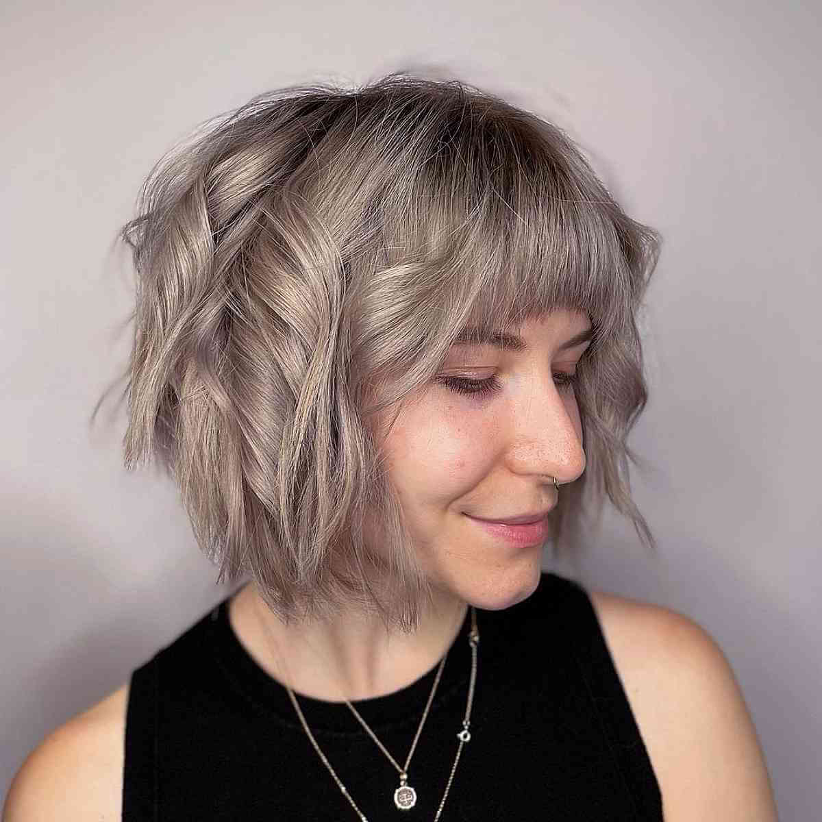 Chin-Length Layered Hairstyle Featuring a Fringe