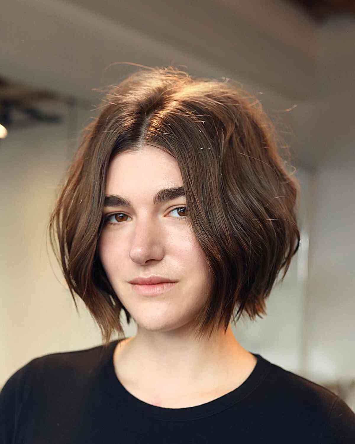 Chin-Length Lived-In Chocolate Bob with Subtle Layering and a middle part with choppy ends