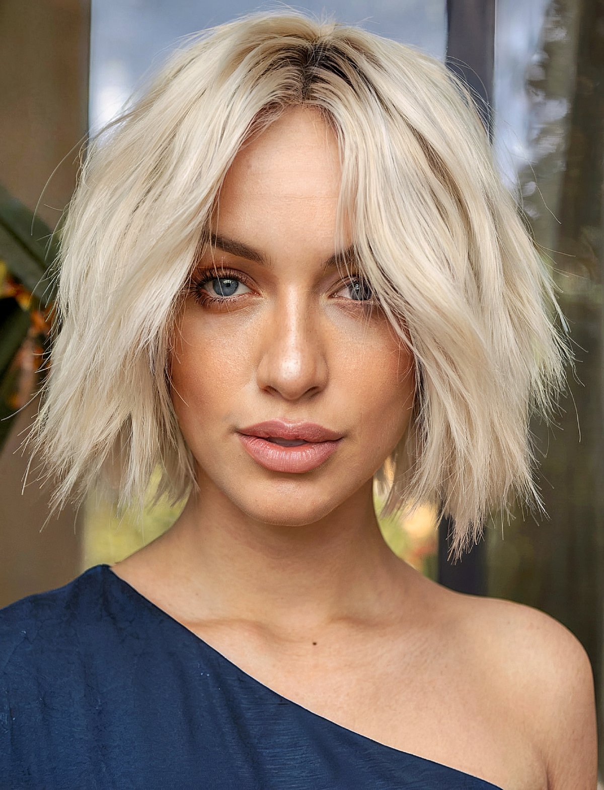 Choppy bob in platinum blonde featuring soft layers perfect for short hairstyles