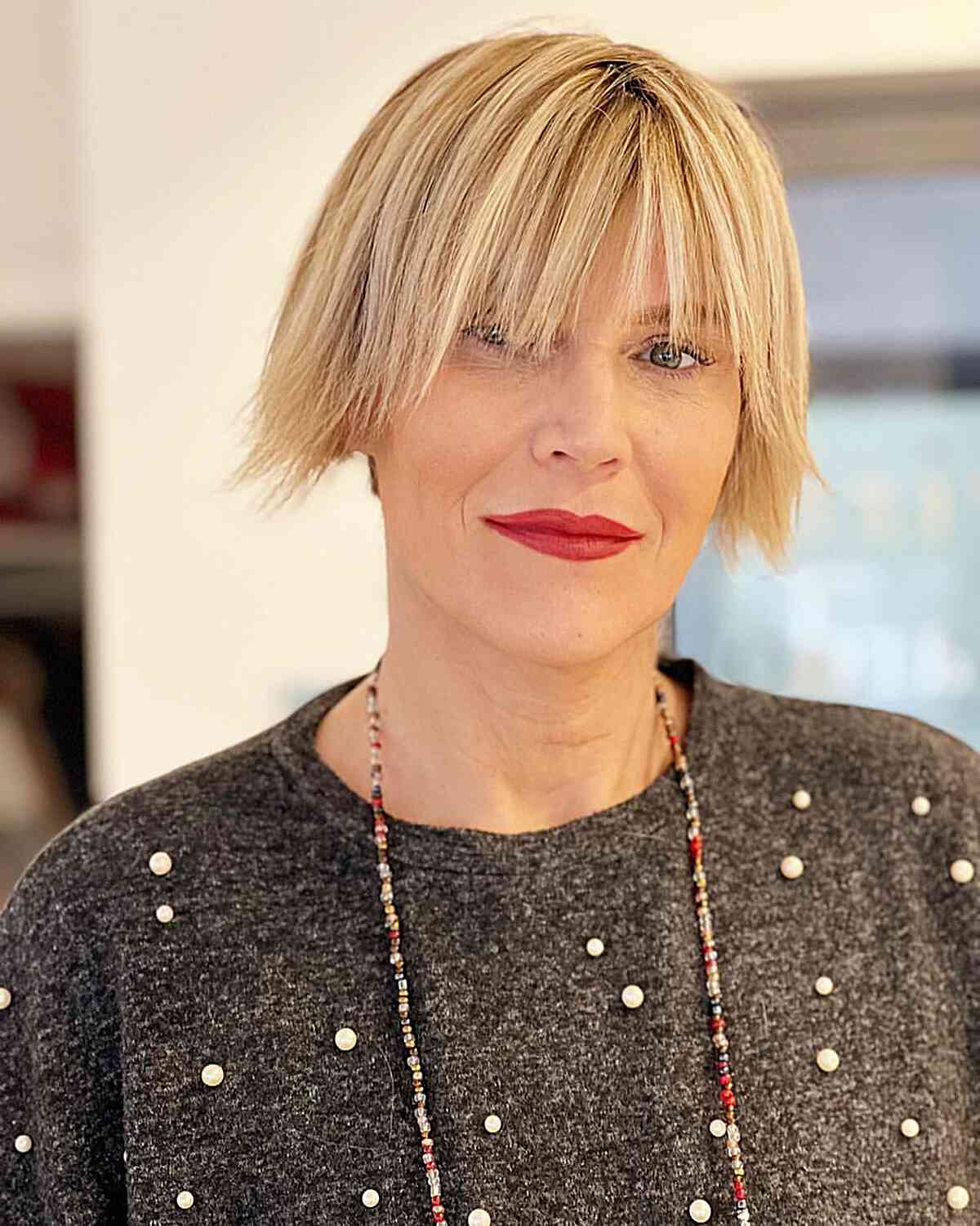 Ear-Length Choppy Bob Style for Straight Tresses featuring piecey ends and bangs grazing the eyes