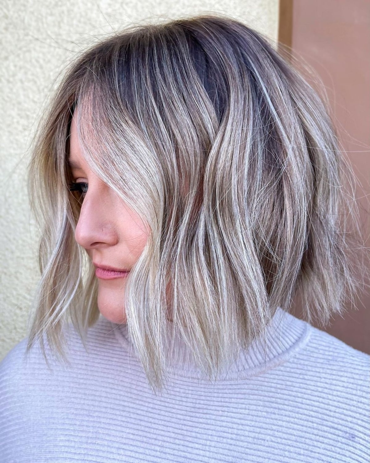 Choppy short bob with ash blonde waves
