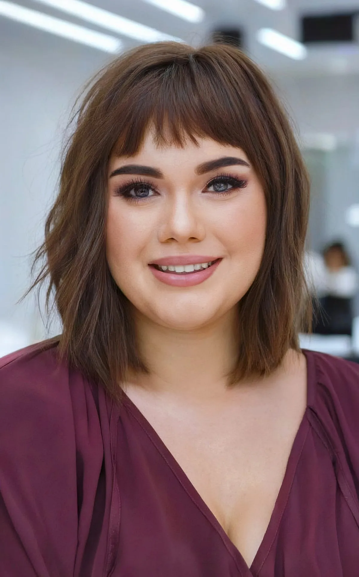 Choppy Layered Brunette Long Bob with Bangs on Women with Round Faces