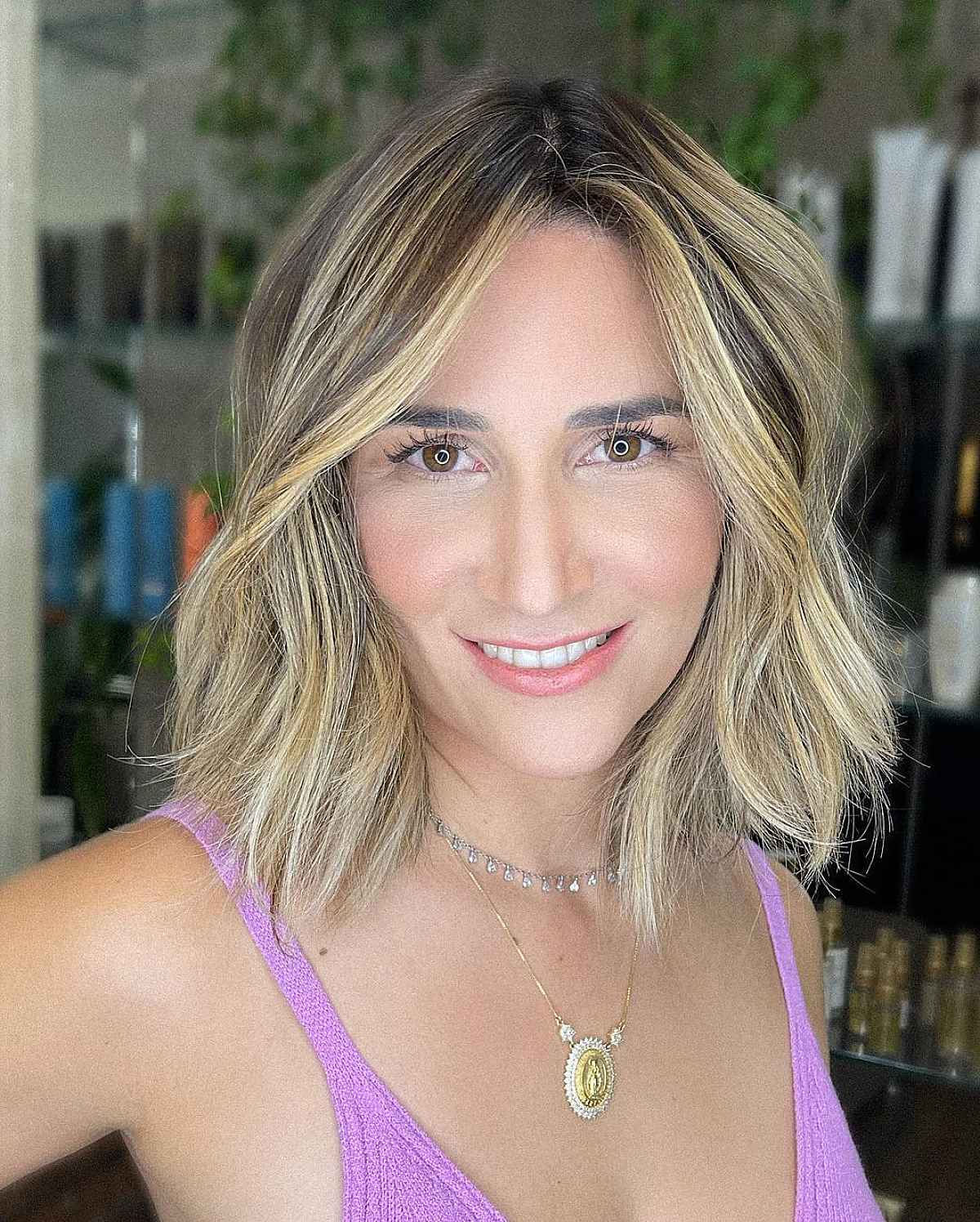 Choppy Neck-Length Haircut Featuring a Center Part