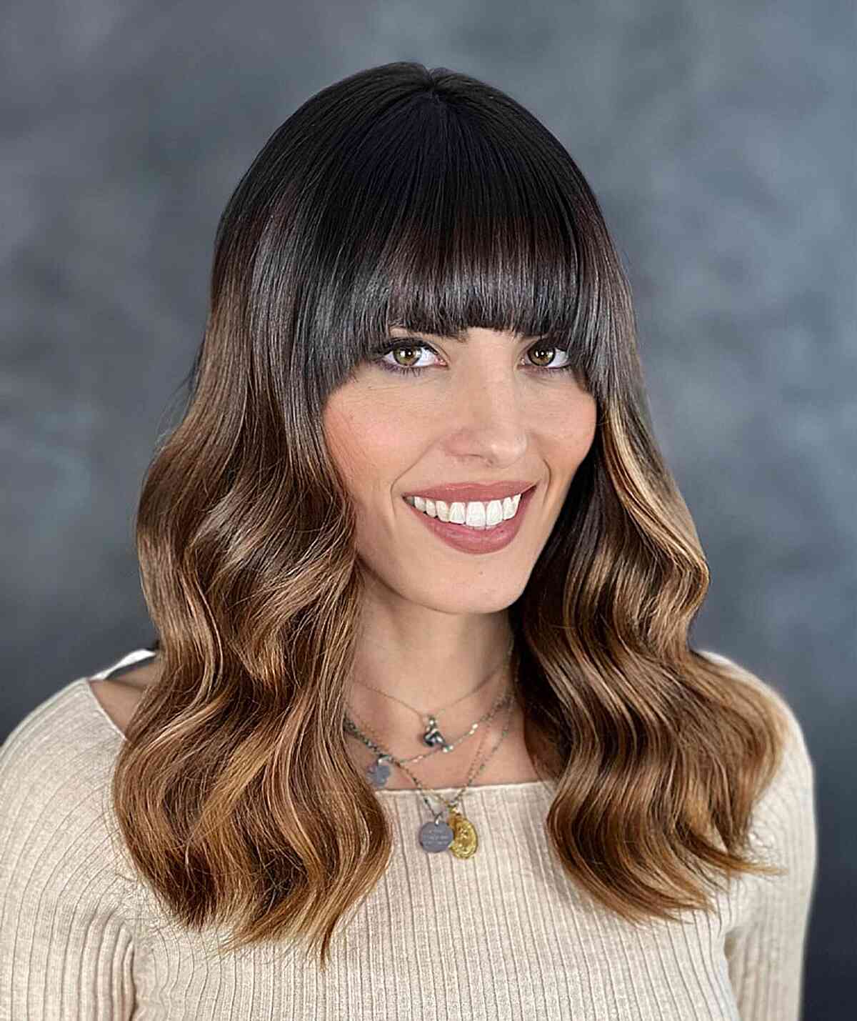 Classy Vintage Style with Wide Bangs for Medium Wavy Hair