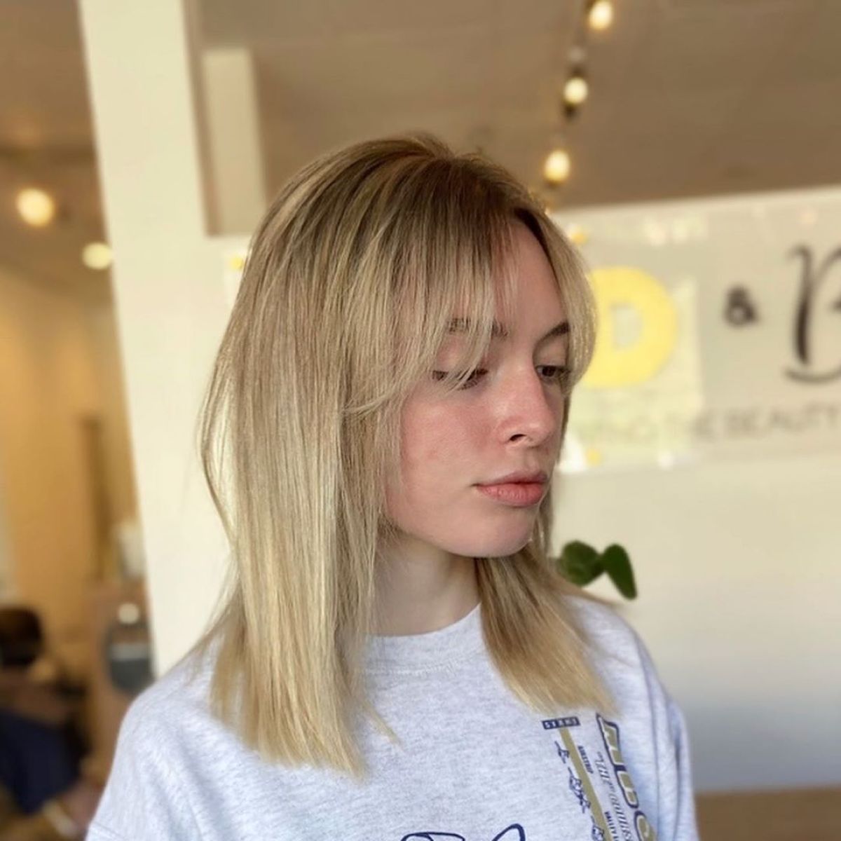 Collarbone-Length Blunt Cut Featuring Curtain Bangs