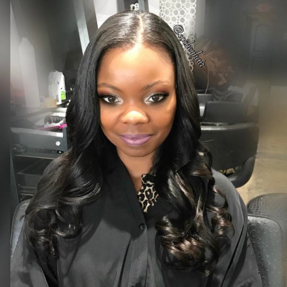 Stylish Complete Sew-In with Body Waves hairstyle for a black girl