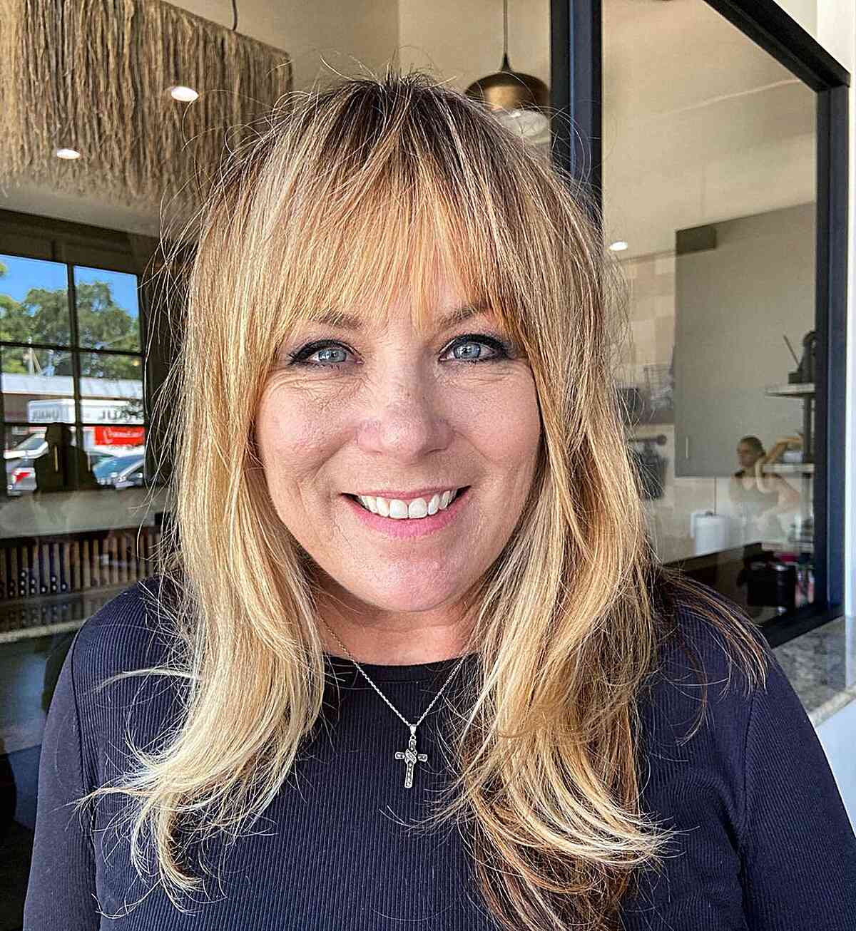 Medium-Length Contemporary Blonde Layers with Fringe