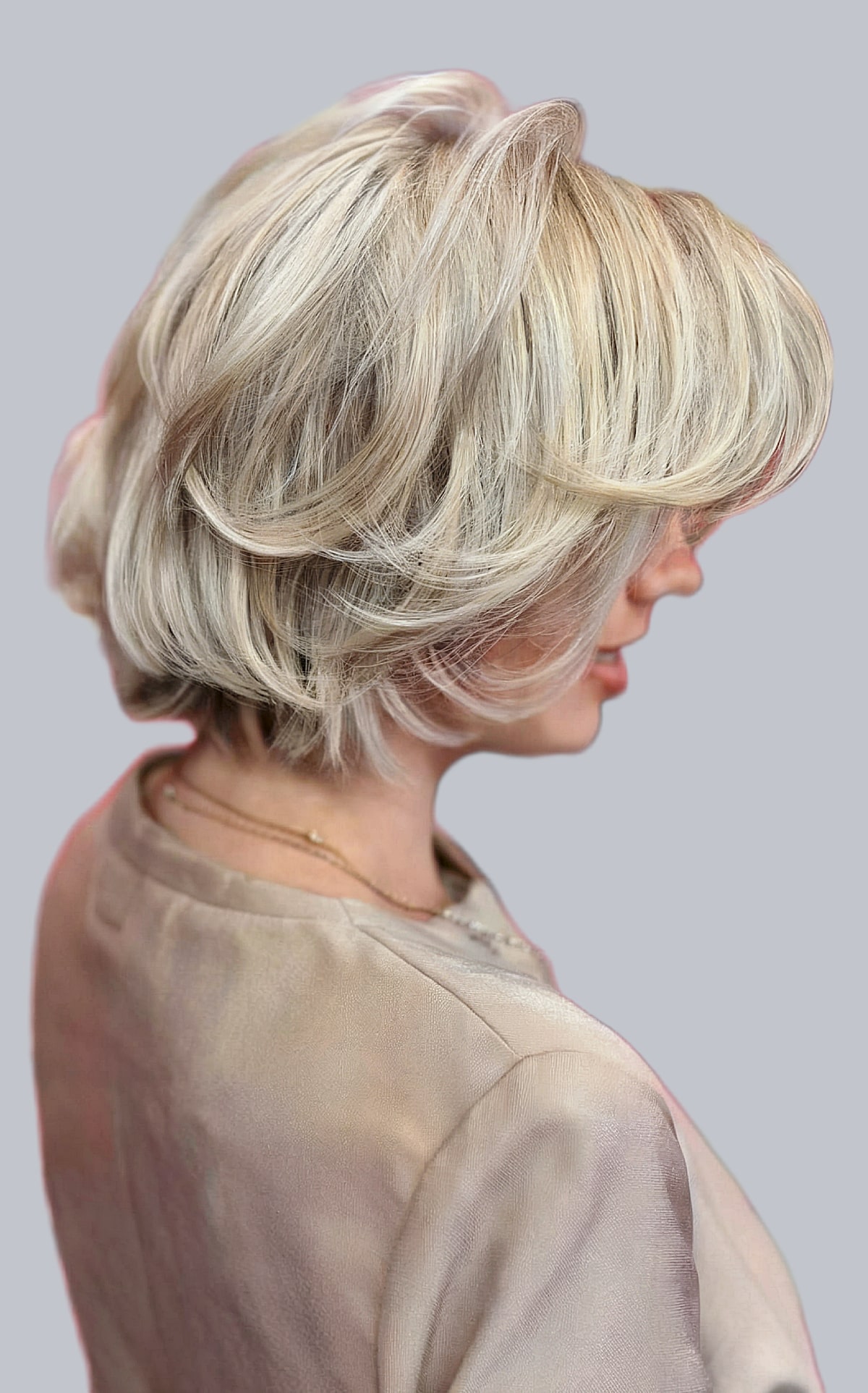 Short Bouncy Contemporary Feathered Bob with Side Bangs