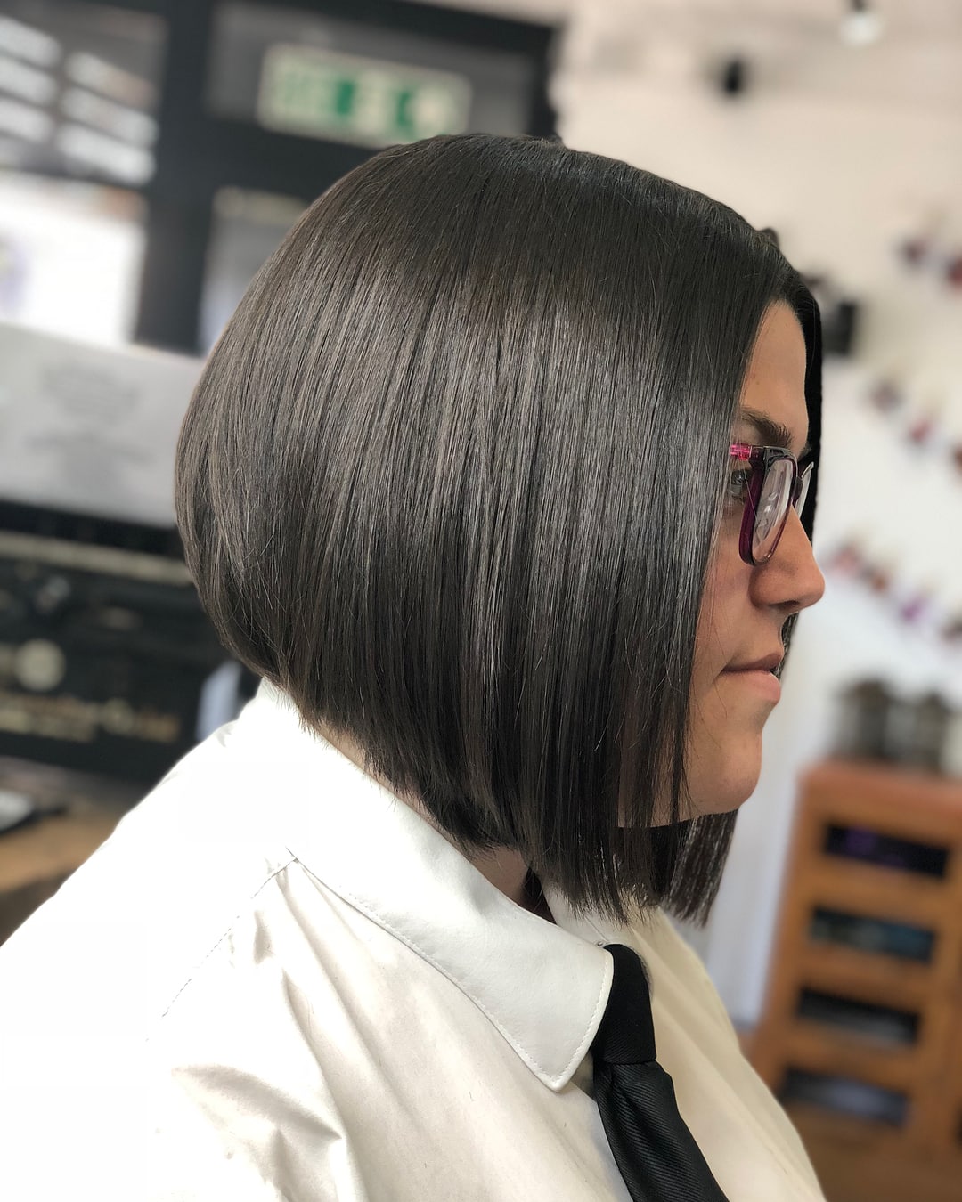 Contemporary Graduated Bob with Eyewear and a Round Face