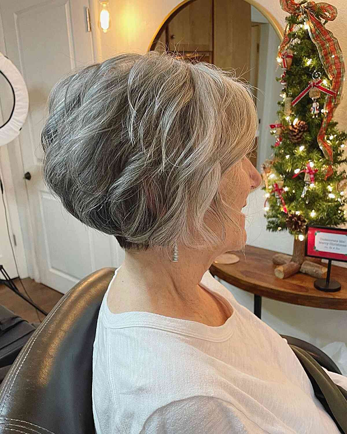 Short Contemporary Wavy Layered Wedge on Older Women with Gray Hair