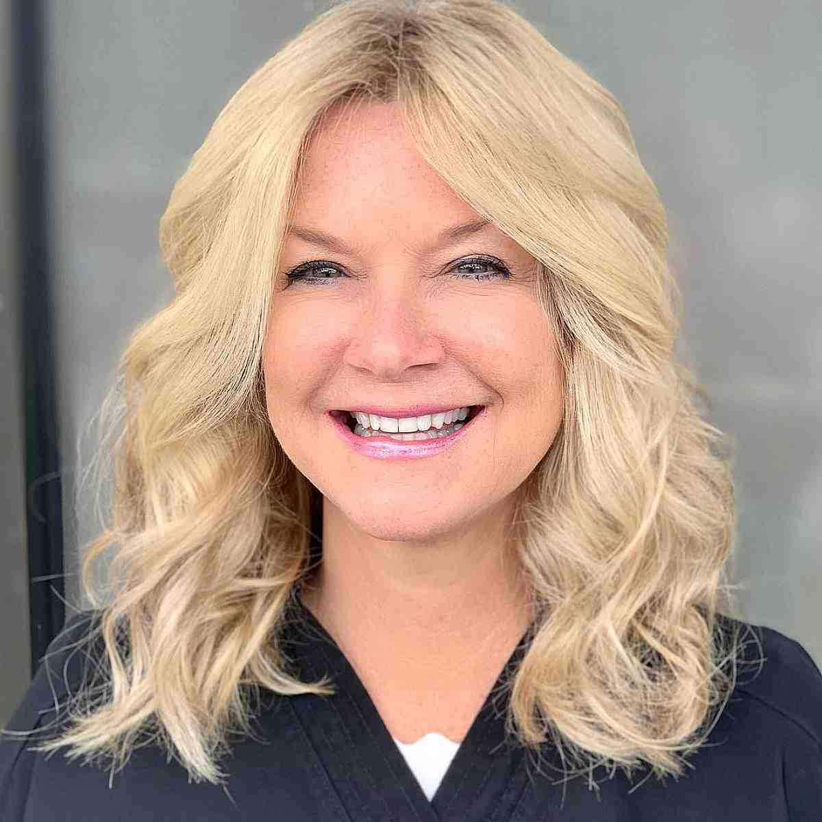 Creamy Blonde on Collarbone-Length Hair for a Woman Over Forty