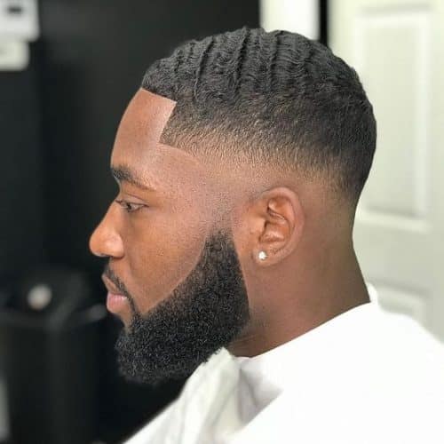 Low bald fade with waves for African American men