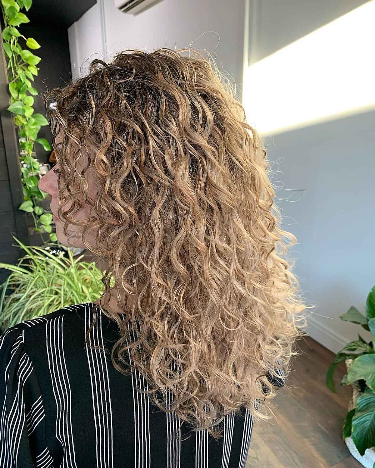 Curly Blonde Hair Enhanced with Lowlights