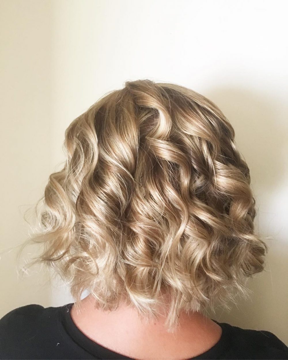 Curly Blonde hairstyle on a bob cut