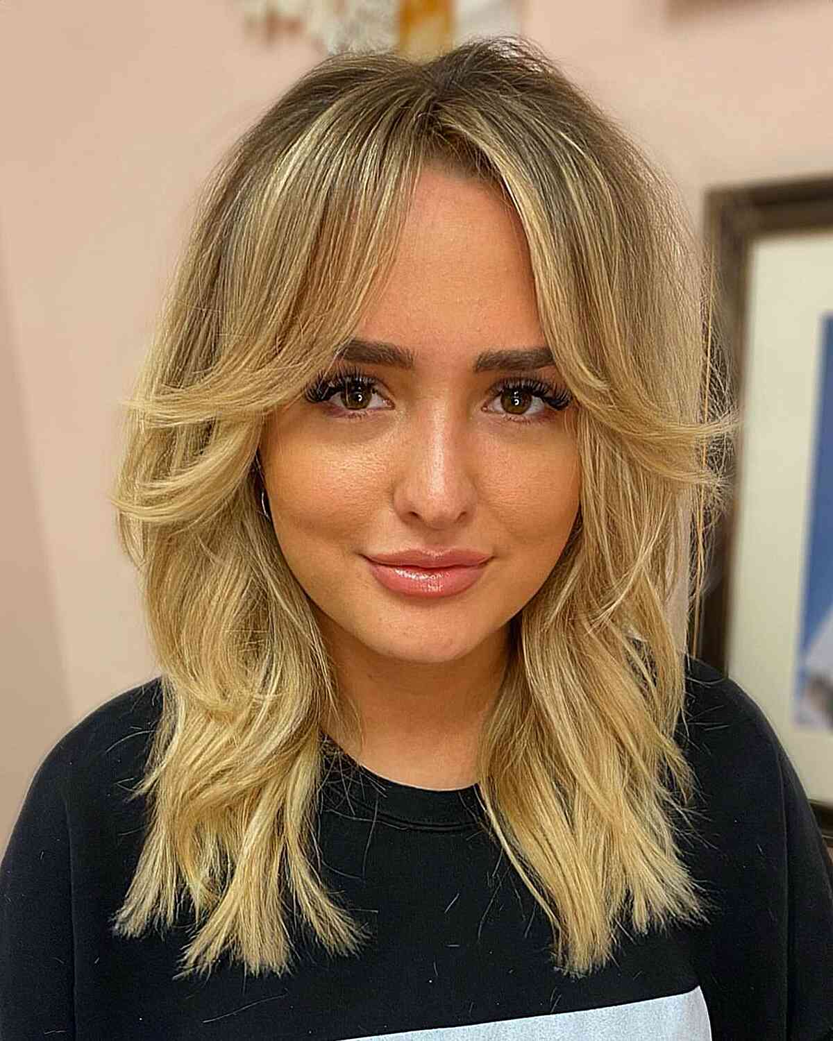 Face-Framing Curtain Bangs on Blonde Mid-Length Hair