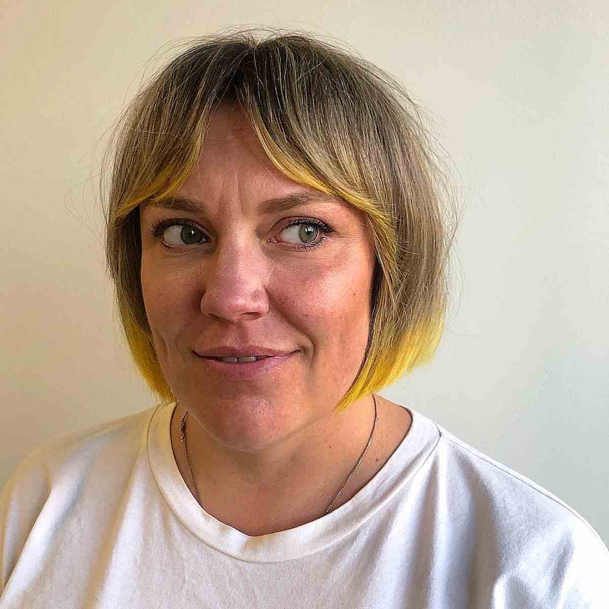 Curtain Bangs on Short Chin-Length Blonde Hair with Lemon Highlights