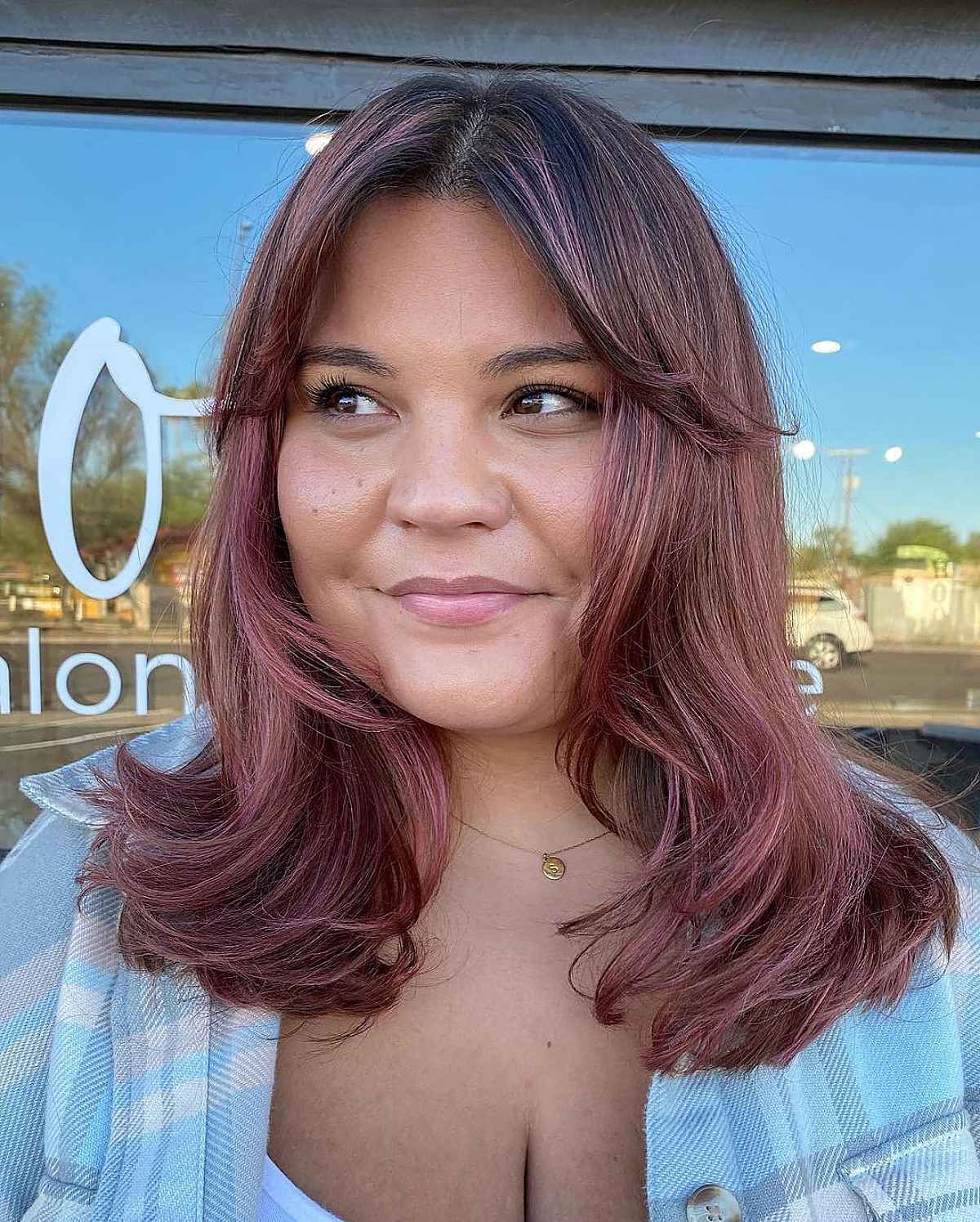 Medium Haircut Featuring Curtain Bangs for Round Faces