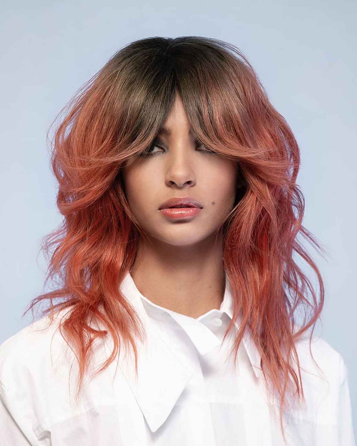 Curtain Bangs with a Wavy Wolf Cut